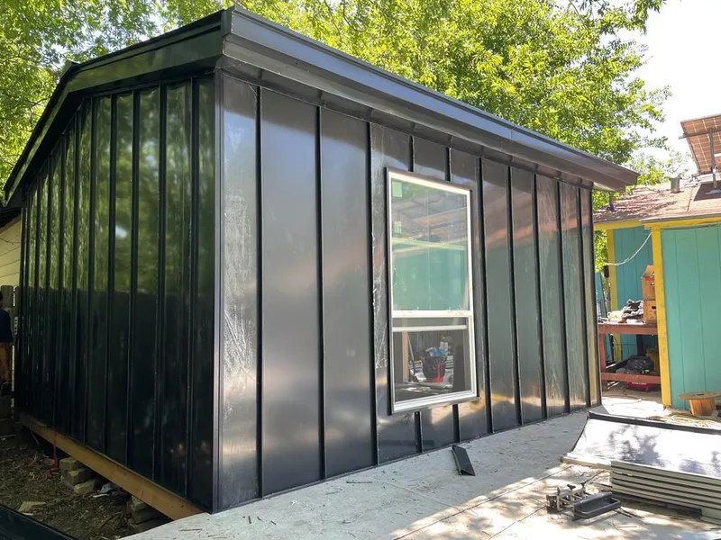 Black standing seam metal wall panels for Roof Inspection in Harrison