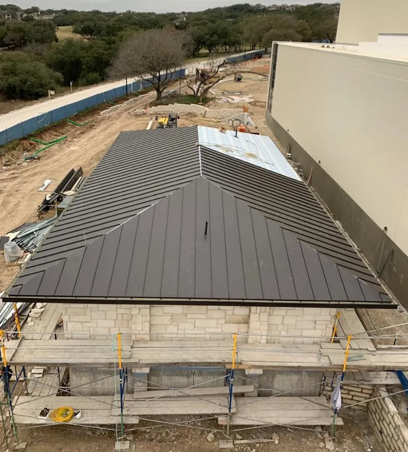 Metal roof new construction with scaffolding in Harrison