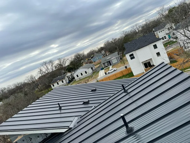 Standing seam metal roof panels with vents for Skylight Repair in Harrison